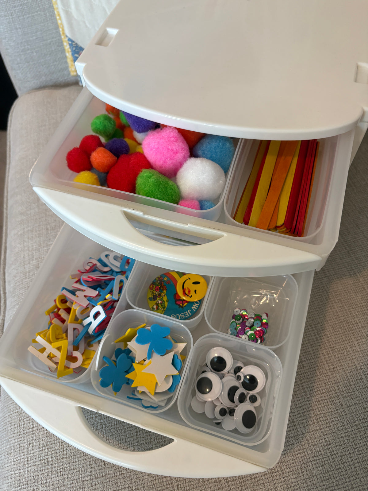 A white plastic organizer TrayWorks slide-out storage set for organizing craft supplies and kids toys in slim-lined bins